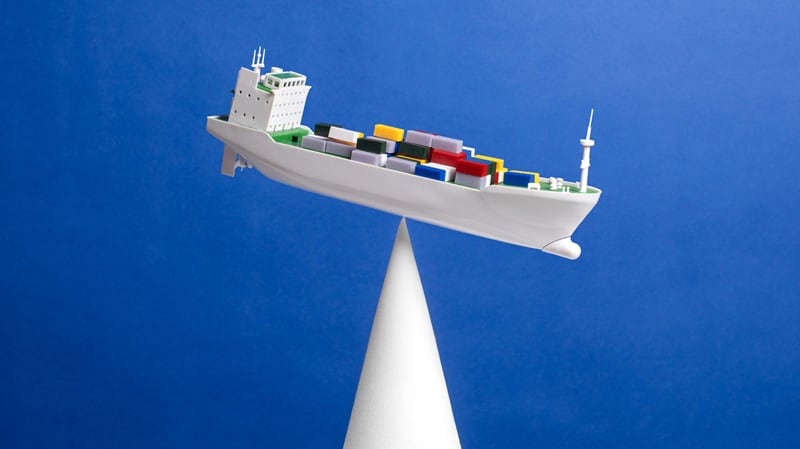 A cargo ship on a tipping scale
