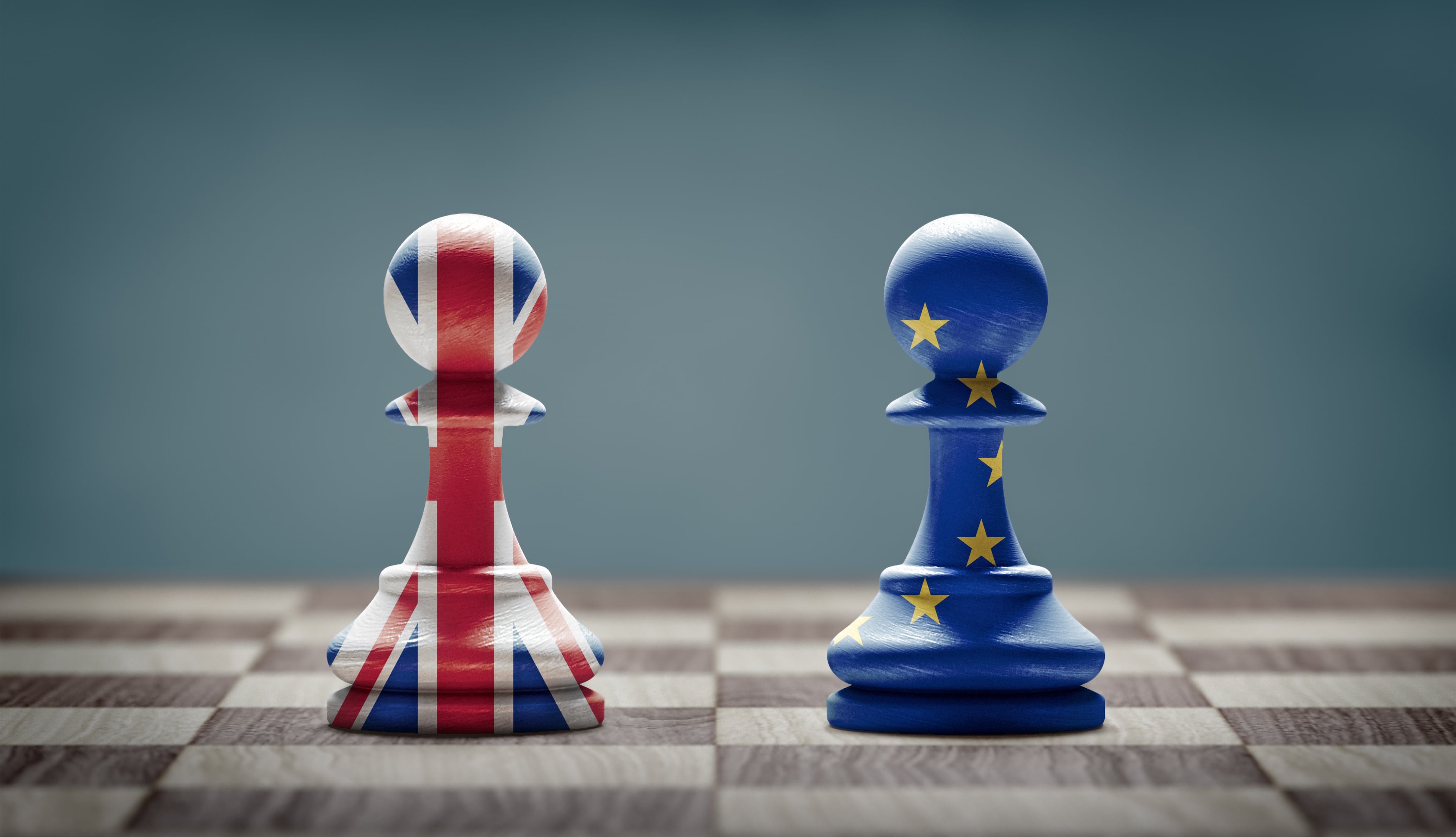 Brexit concept.United Kingdom and European Union flags on chess pawns on a chessboard. 3d illustration.
