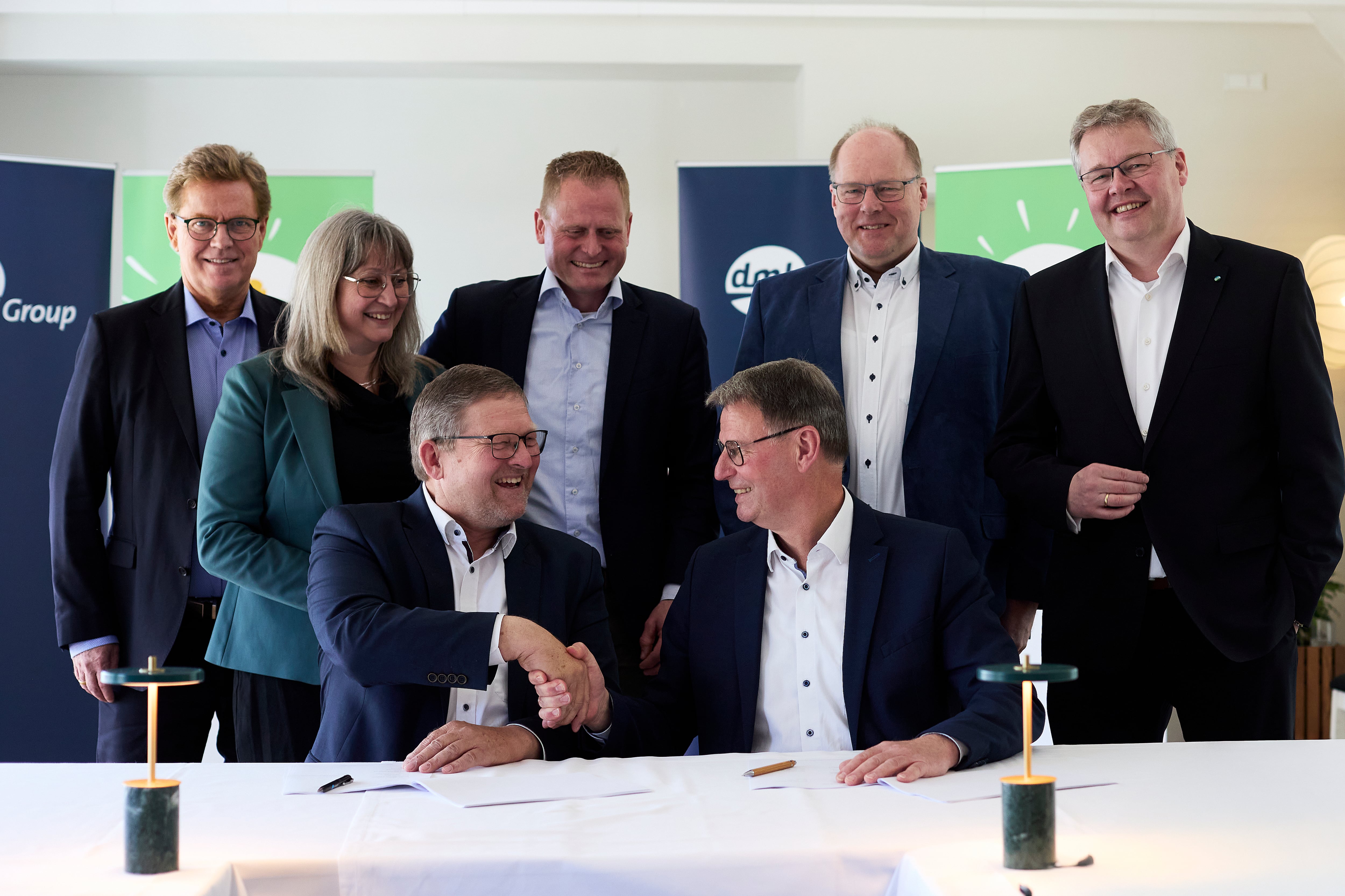 businesspeople shaking on a deal