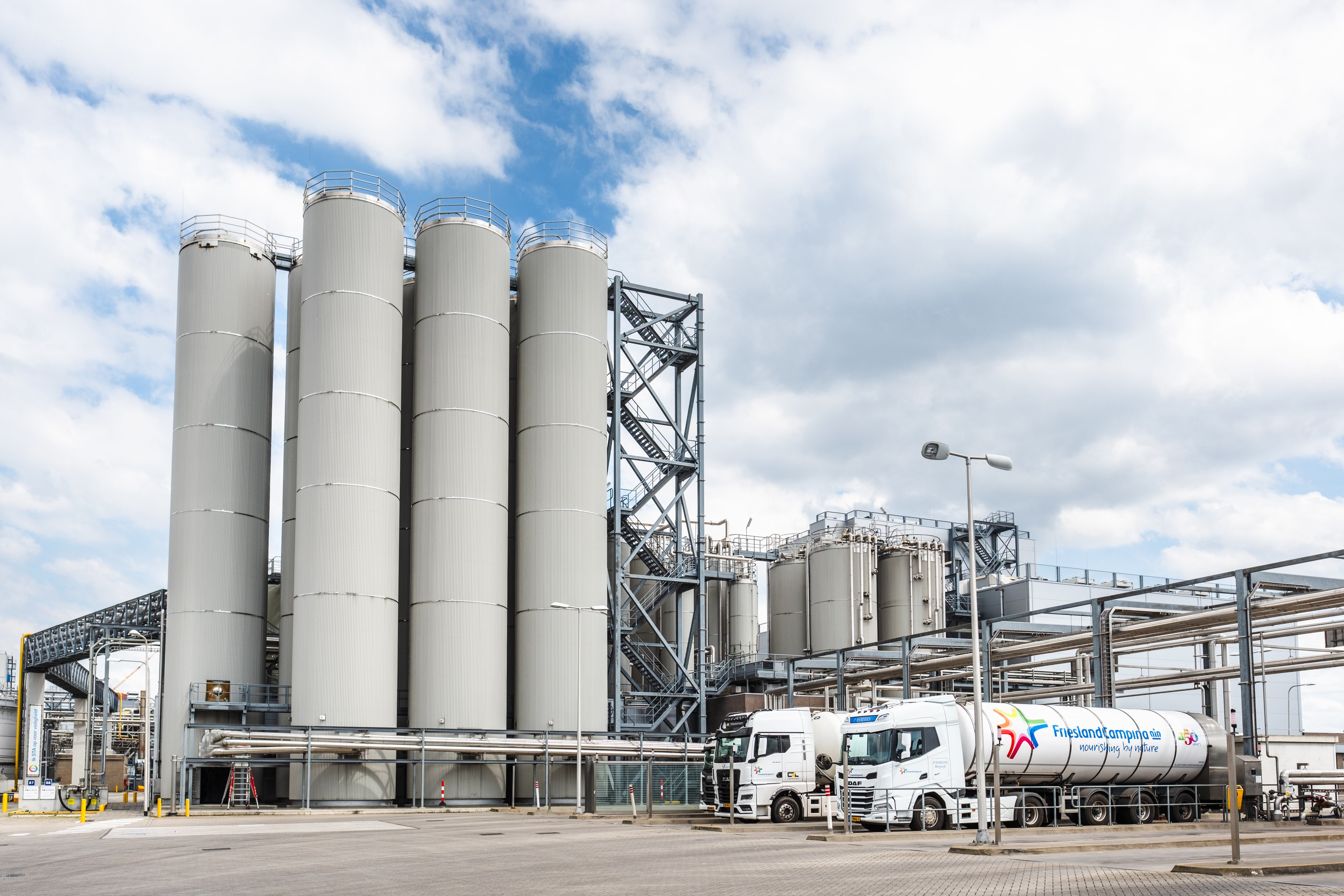 FrieslandCampina Veghel industrial building and logo trucks.