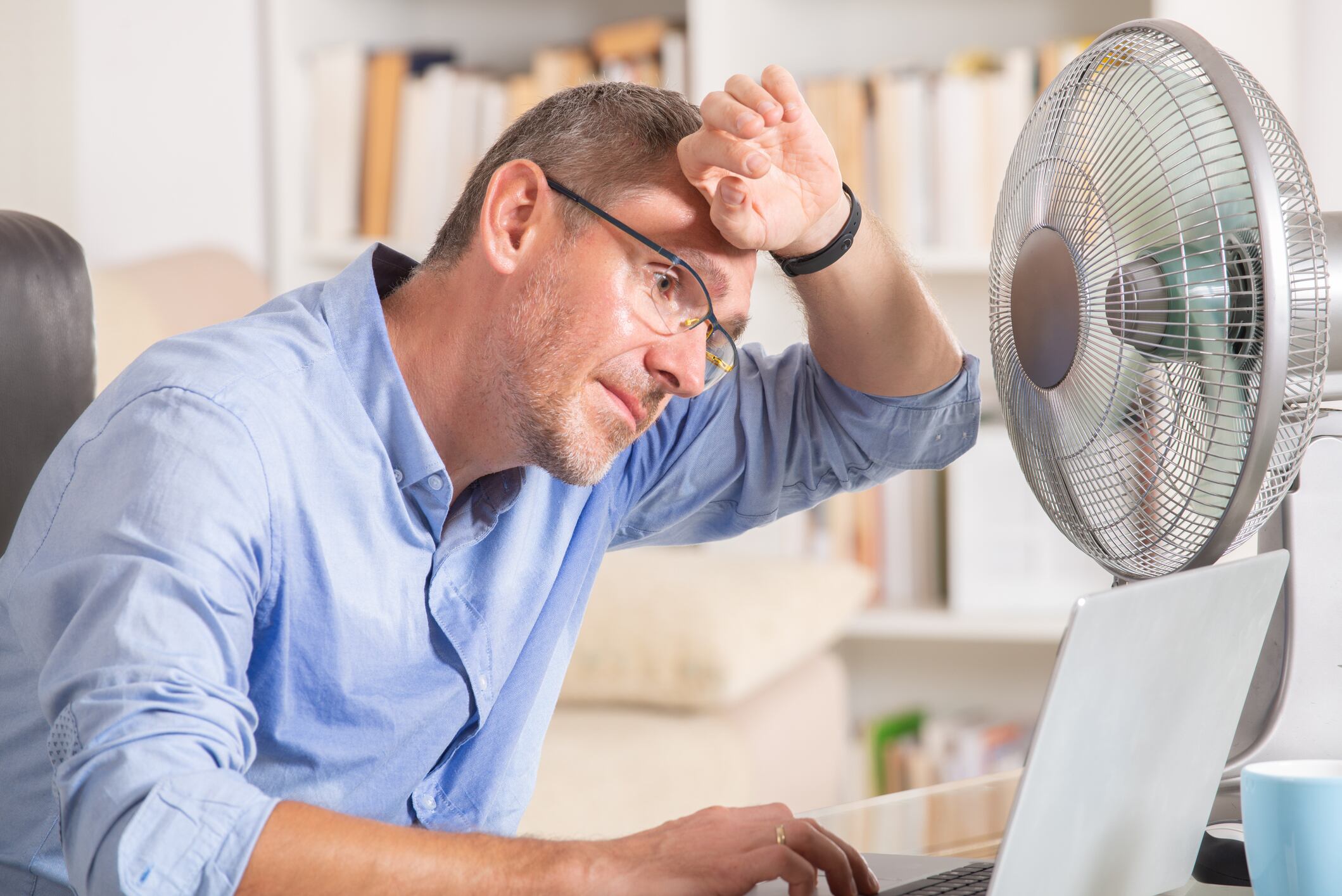 Man suffers from heat while working