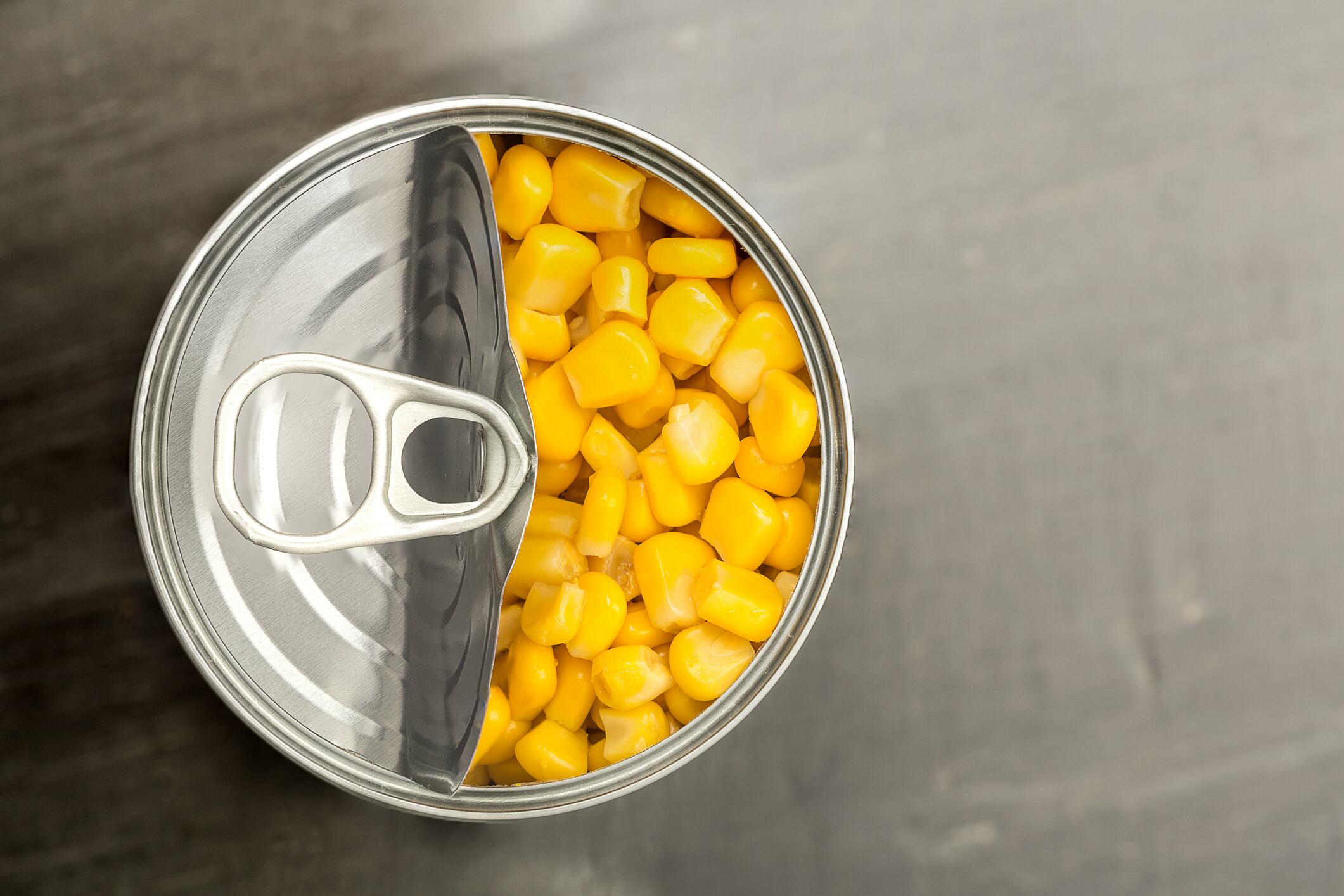 looking down on a tin can of sweet corn
