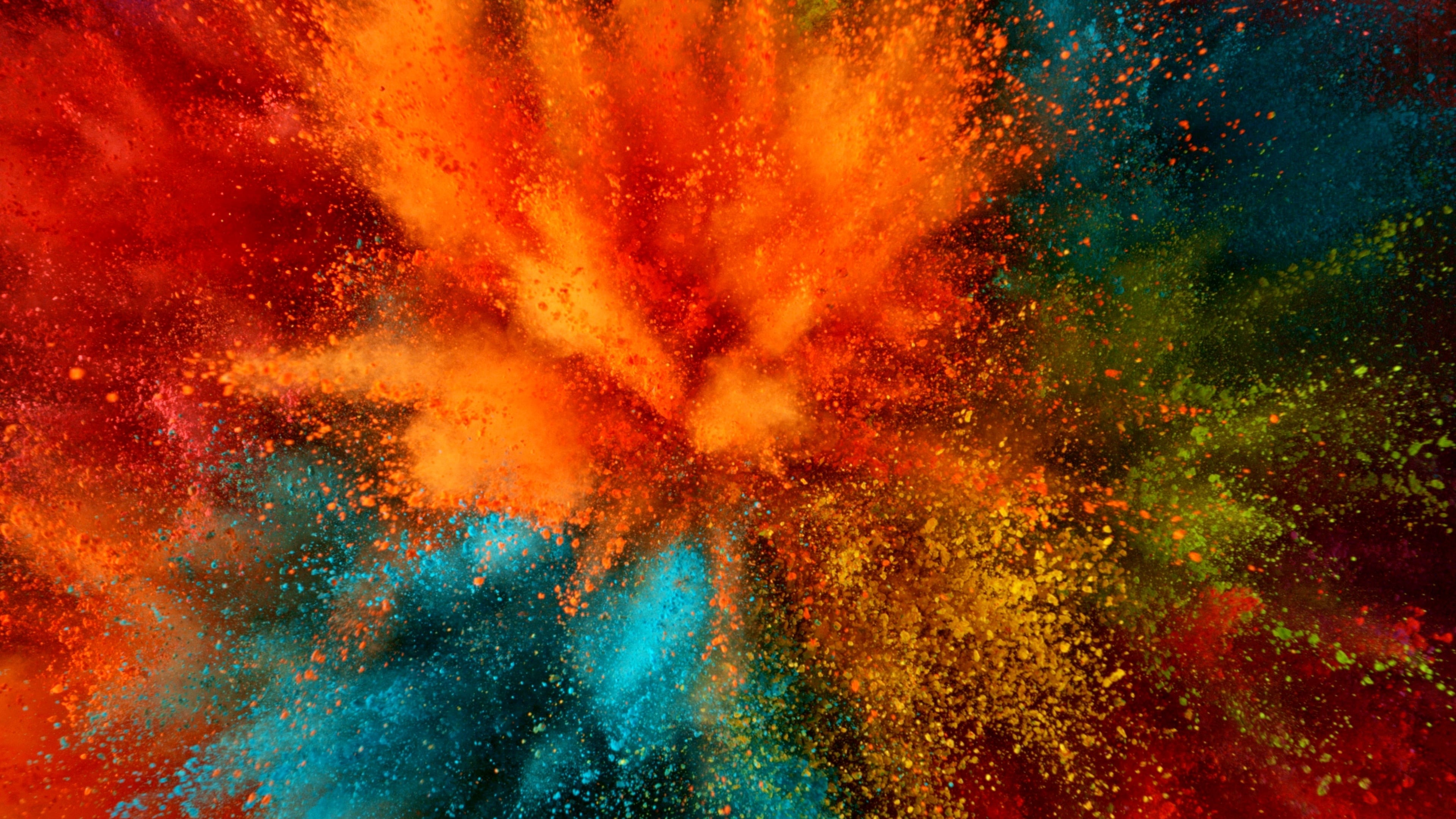 Freeze motion of coloured powder explosion. Abstract background.