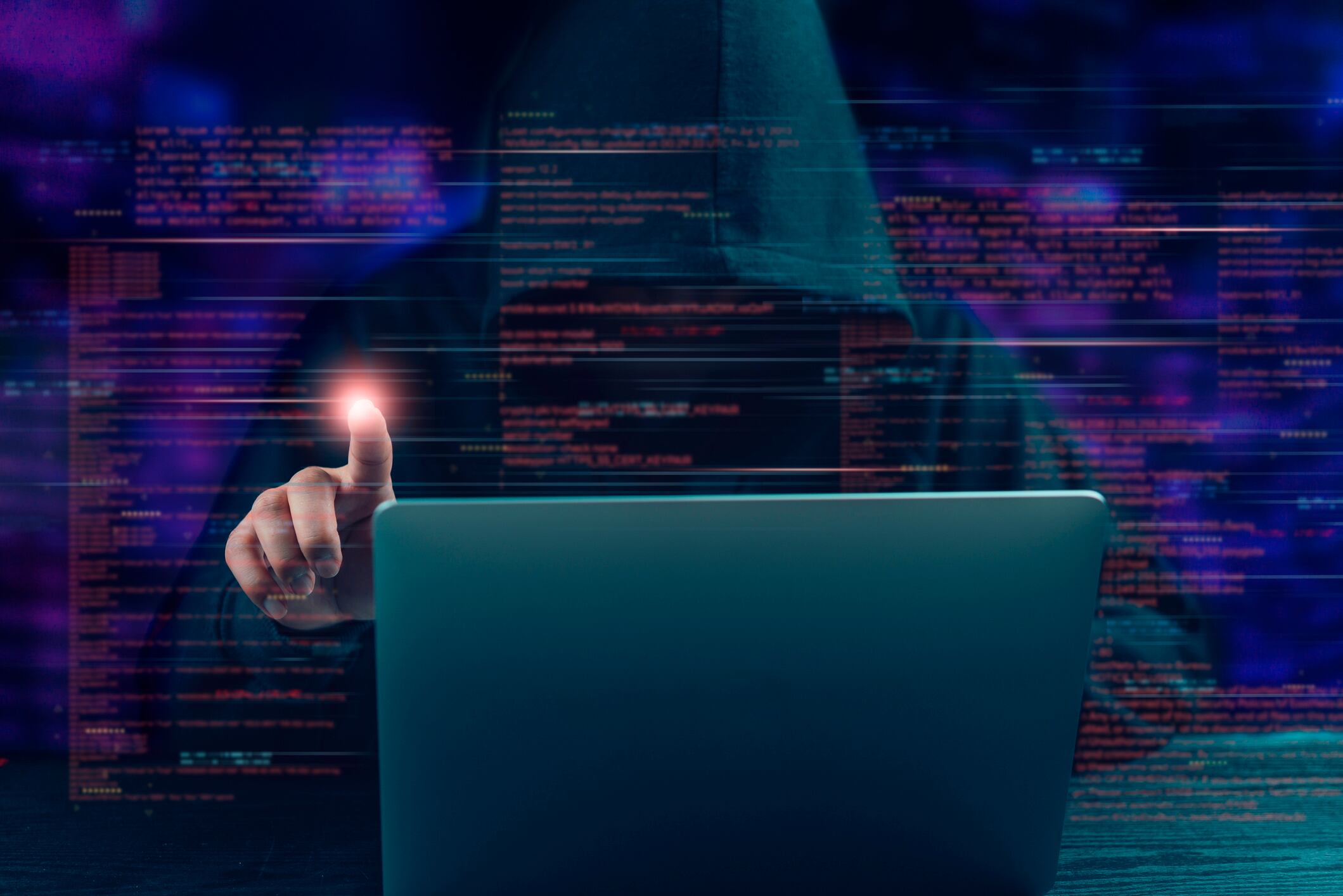 Cybercrime concept. Hacker in hoodie interacts with glowing digital interface - data breach, cyber attack, and the dark side of technology.
