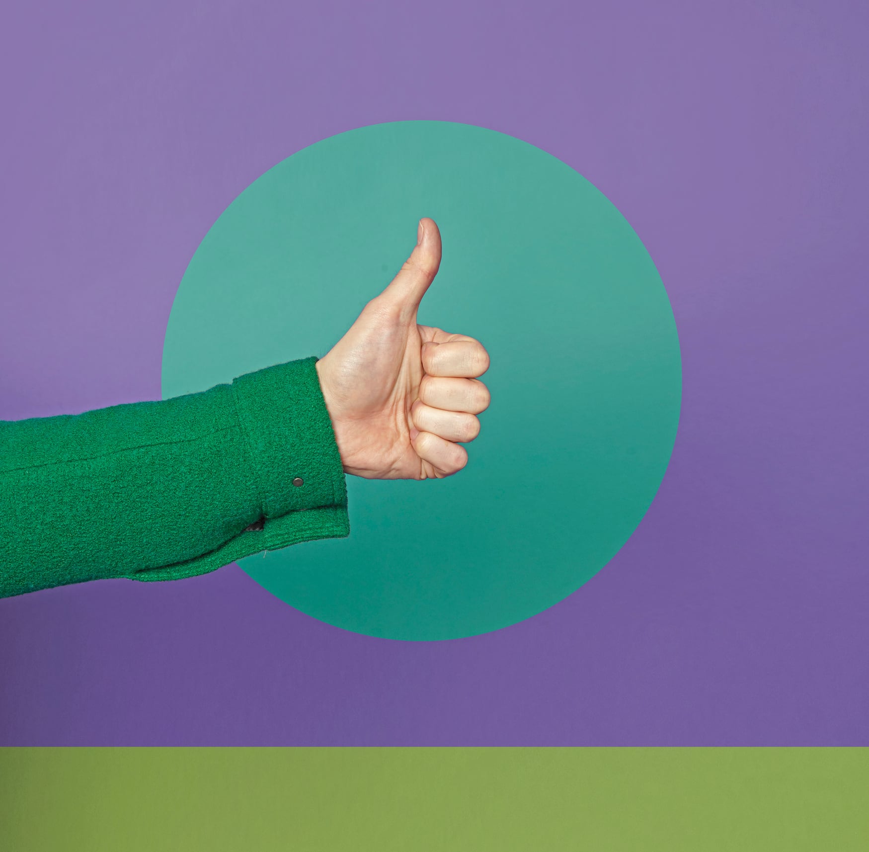 man holding thumbs up against colourful background