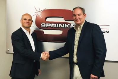 L to R: Holger Beckmann, president and CEO of Krones; and Brian Sprinkman, president of W.M. Sprinkman.