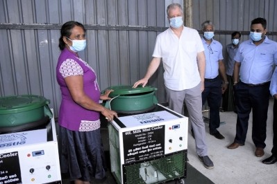 Fabrice Cavallin, Nestlé’s managing director, donating a mini cooler to a Sri Lankan Nestlé dairy farmer. Pic: Nestlé