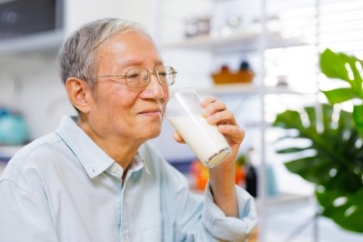 An elderly man drinking a glass of milk. ©Getty Images 