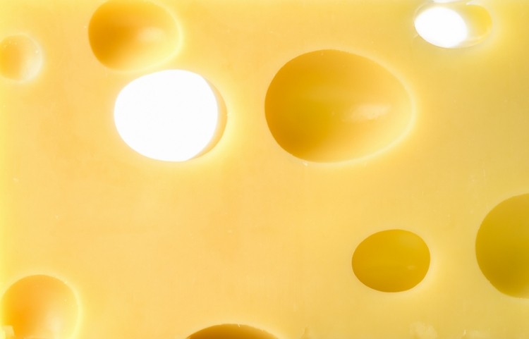 There's a hole in the belief carbon dioxide produced by bacteria forms the eyes found in Emmental, say Swiss researchers.