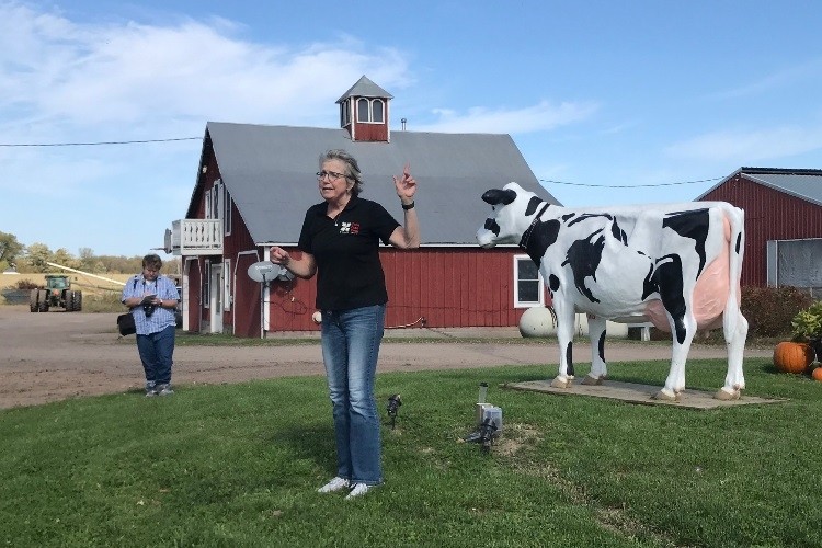 Officials from UW on a recent visit to a local Wisconsin dairy farm.