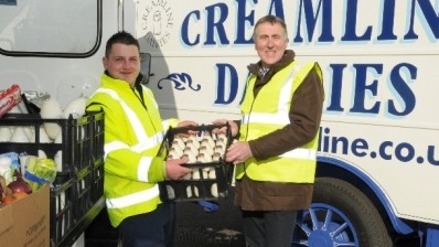 Charlie Thomas, left, won the UK Milkman of the Year award. He is seen here with George Jones, who previously did the round Thomas now covers.