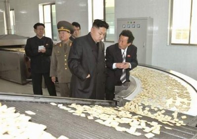 Kim Jong Un inspecting cracker production line in North Korea.
