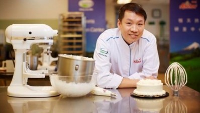 Anchor Food Professionals chief director China chef team Teoh Joo Cheong in the kitchen with UHT whipping cream.