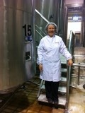 Thea Murphy, MD, Silver Pail, stands with the company’s mix tanks. Milk and cream are fed into the containers to be mixed and then pasteurized and homogenized.  It takes a plant like this 24-48 hours from the arrival of fresh milk to turn it into finished consumable products.